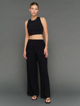 Model is wearing Melt scallop edge cropped bra in black white, front full body view.