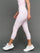 Model wears Gingham Capri Leggings on a grey background