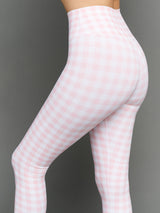 Model wears Gingham Capri Leggings on a grey background