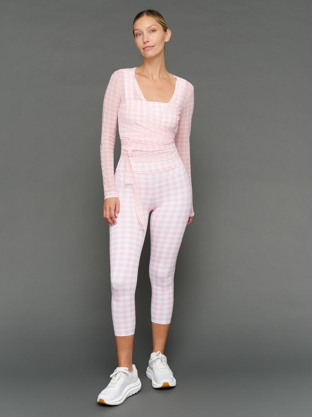 Model wears a Gingham outfit on a grey background