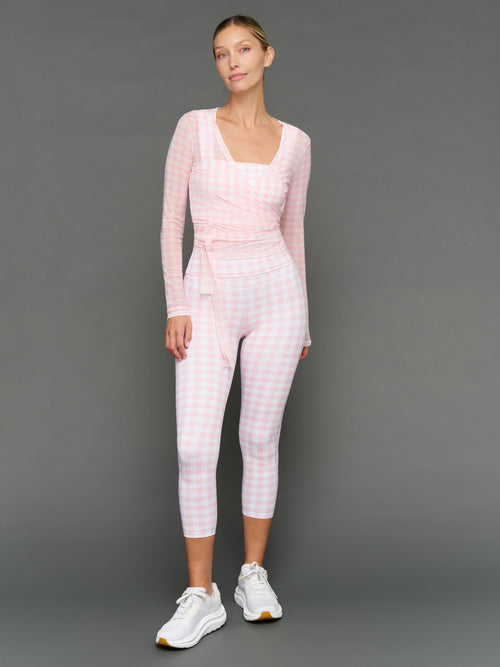 Model wears a Gingham outfit on a grey background