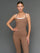 Model is wearing double layer melt tank caribou white, front upper body view.
