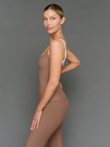 Model is wearing double layer melt tank caribou white, side profile view.
