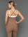 Model is wearing double layer melt tank caribou white, back full body view.