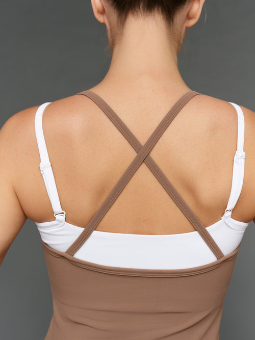 Model is wearing double layer melt tank caribou white, back strap close-up detail.