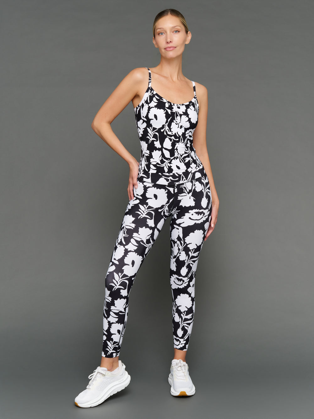 Model is wearing melt ruched tank floral print with matching leggings, front view.