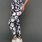 Model is wearing melt high-waisted legging floral print, front angled view.