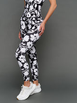 Model is wearing melt high-waisted legging floral print, front angled view.