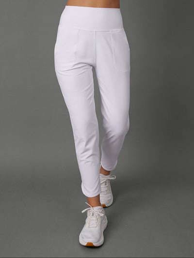 White high-waisted athletic leggings with a side pocket, shown on a model from the waist down against a solid gray studio background.