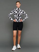 Model is wearing melt full zip jacket floral print, front full body view.