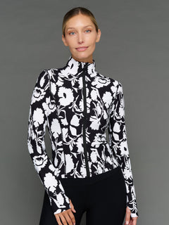 Model is wearing melt full zip jacket floral print, front view.