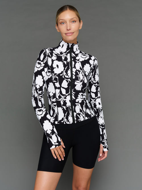 Model is wearing melt full zip jacket floral print, front view.