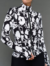 Model is wearing melt full zip jacket floral print, close-up zipper detail.