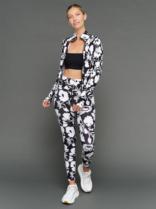 Model is wearing melt full zip jacket floral print with matching set, full body view.