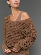 Model is wearing wide neck open knit sweater in caribou, texture close-up view.