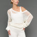 Model is wearing wide neck open knit sweater white, front three-quarter view.