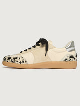 Cowhair low top neutral sneaker with black laces. 