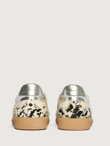 Cowhair low top neutral sneaker with black laces. 