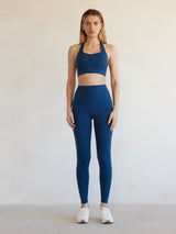 Full front view of model wearing French Navy Diamond Compression leggings with matching bra.